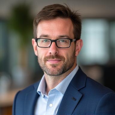 Professional headshot of Ben Carter.